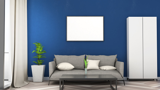 Mockup frame on blue wall with sofa ,Modern style,Poster Mocku