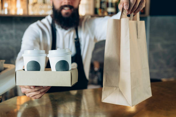 istock An Anonymous Barista Holding a Take Away Order 1337635513
