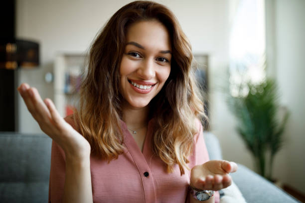 istock Smiling confident young woman having online conference from home office 1337642321