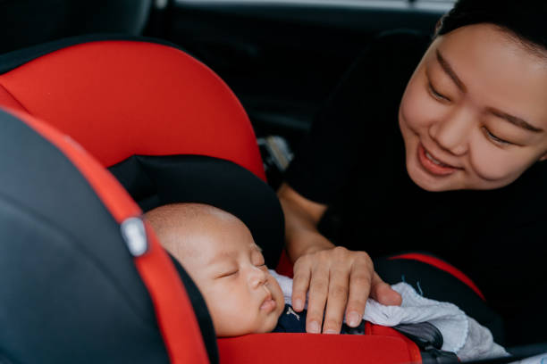 istock Asian baby sleeping in car safety seat 1337645080