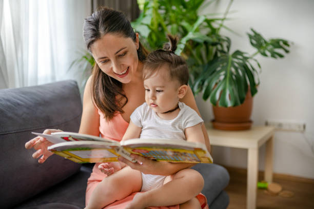 istock Young mother reading book to her toddler 1337646744