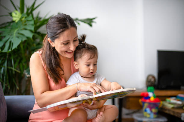 istock young mother reading a book to her toddler 1337646840