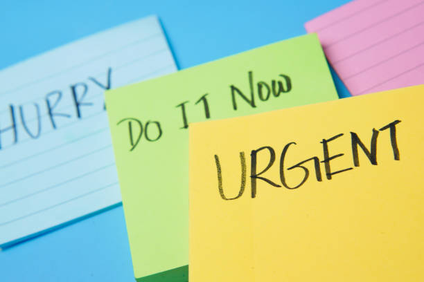 istock close up of urgent word on a stick note paper . 1337647137