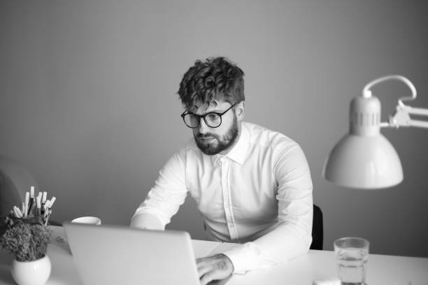 istock Man working on laptop stock photo 1337649560