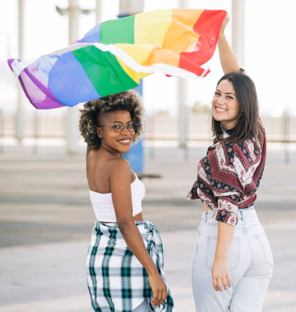 istock empowered women, with gay pride flag 1337650709