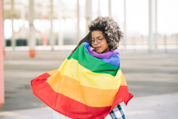 istock girlfriends hug gay pride flag 1337650712