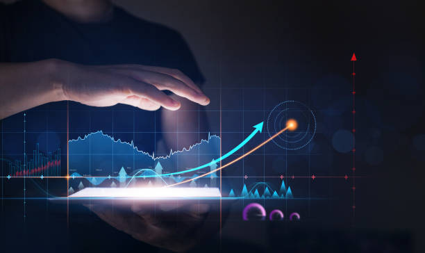 istock Businessman holding tablet with growing virtual hologram of statistics, graph and chart. Business strategy development and growing growth plan. 1337651018