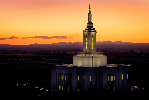 Pocatello Idaho LDS Mormon Latter-day Saint Temple with lights at sunset Angel Moroni