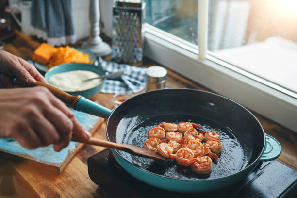 Preparing Shrimp, Bacon and Grits in Domestic Kitchen