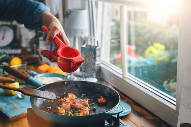 istock Preparing Shrimp, Bacon and Grits in Domestic Kitchen 1337665150