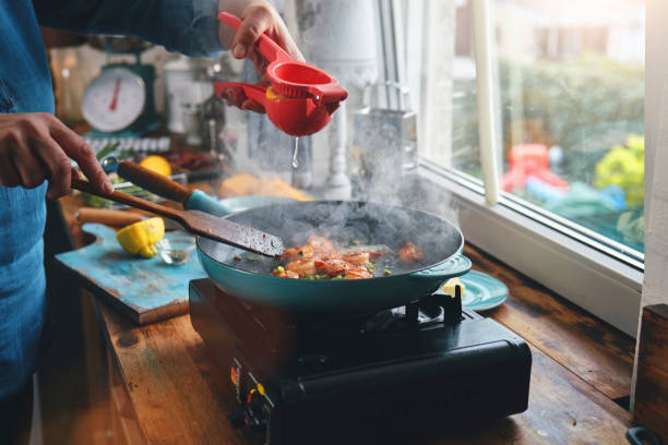 istock Preparing Shrimp, Bacon and Grits in Domestic Kitchen 1337665702