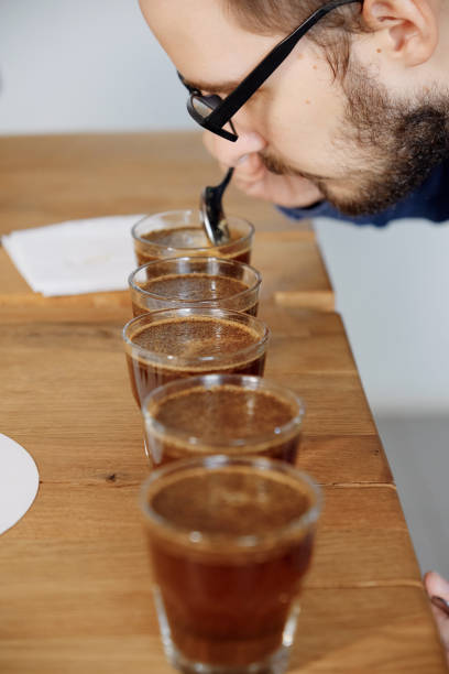 istock Man smelling freshly ground coffee in cup 1337666310