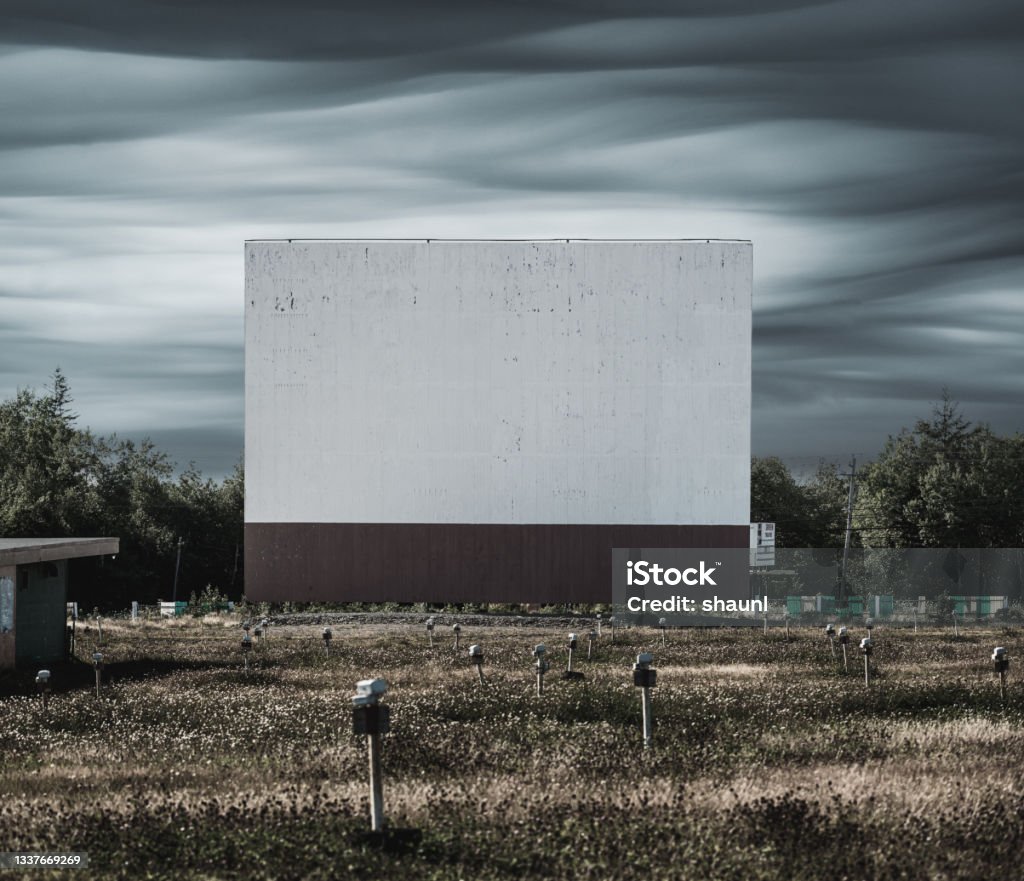 Drive In Movie Theatre An abandoned drive in movie theatre. Composite image. Drive-in Movie Stock Photo