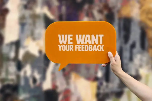 Photo of We want your feedback word with speech bubble