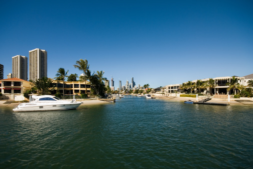 A waterway scene, with luxury homes and apartment buildings, Surfers Paradise, Queensland, Australia