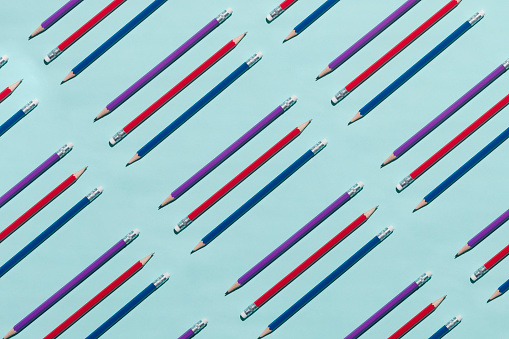 Erasable wooden pencils  flat lay on blue background