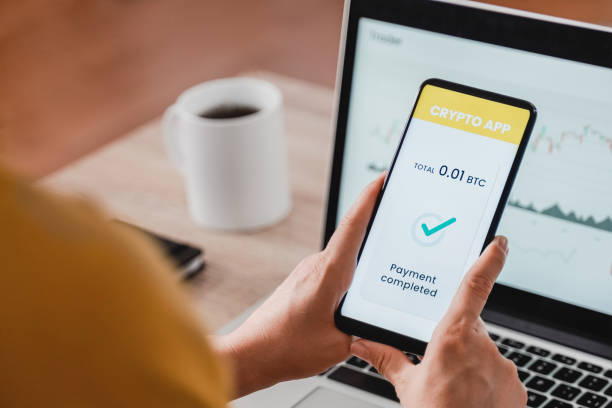 istock Trader woman using bitcoin crypto payment service provider app with mobile phone - Cryptocurrency trend technology concept - Focus on screen 1337677187