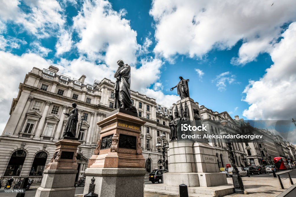 Crimean War Monuments In London, UK London, UK - 9th of August 2019: A side view of the Crimean war memorial with the buildings around it London - England Stock Photo