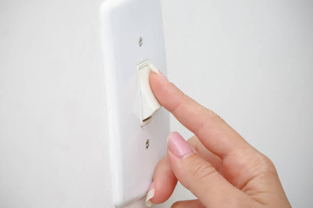 istock power from a light bulb on the ceiling and power outlet. 1337683384