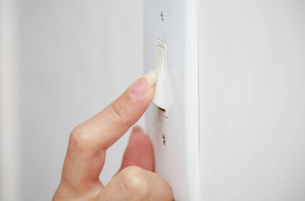 istock power from a light bulb on the ceiling and power outlet. 1337683393