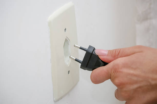 istock power from a light bulb on the ceiling and power outlet. 1337683425