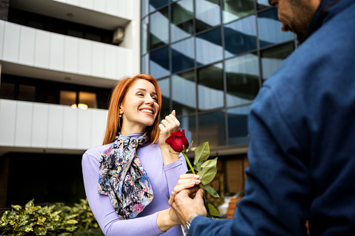 Young woman is surprised by a romantic gesture