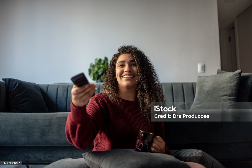 Woman watching television Watching TV Stock Photo