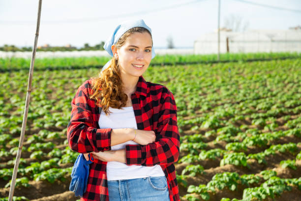 istock Smiling professional female farmer on a plantation 1337693751