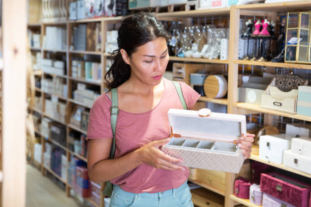 istock Asian woman choosing storage container at store 1337695158