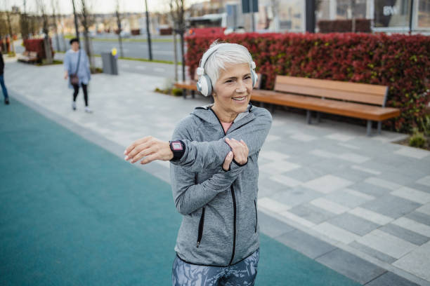 istock Senior woman doing pre-workout warm-up exercises 1337696487