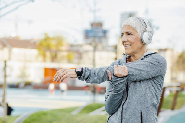 istock Senior woman doing pre-workout warm-up exercises 1337696807