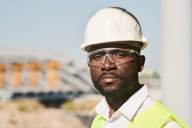 istock Portrait of young male engineer posing at construction site 1337699116