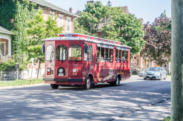 EASTON, PA - August 11, 2018: red trolley on the bus stop in EASTON. EASTON Trolley provides free transportation in the city