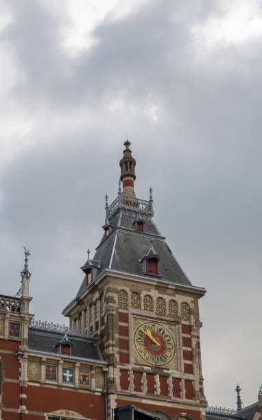 istock Time clock on right tower of Centraal railway station, Amsterdam, Netherlands 1337700953