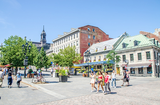 People walking in Place Jacques-Cartier in the Old Montreal during summer day
