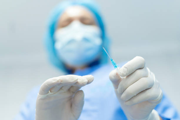 istock Nurse prepares needles to channel passient 1337708961