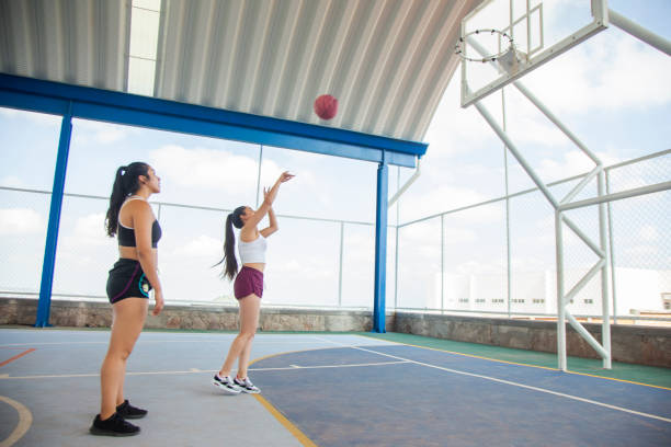istock Young women playing basketball 1337709781