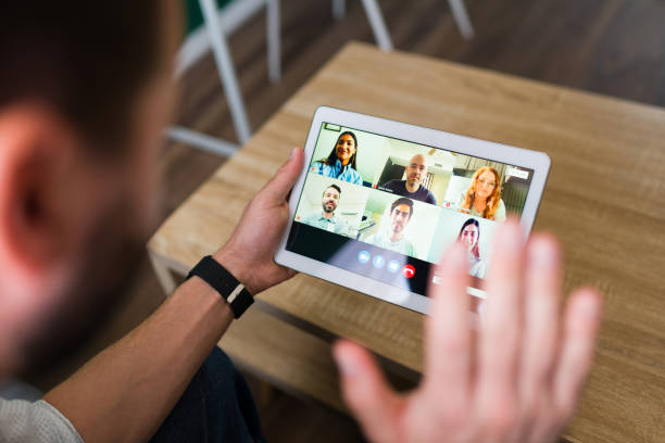 istock Rear view of a man having a video call 1337712756