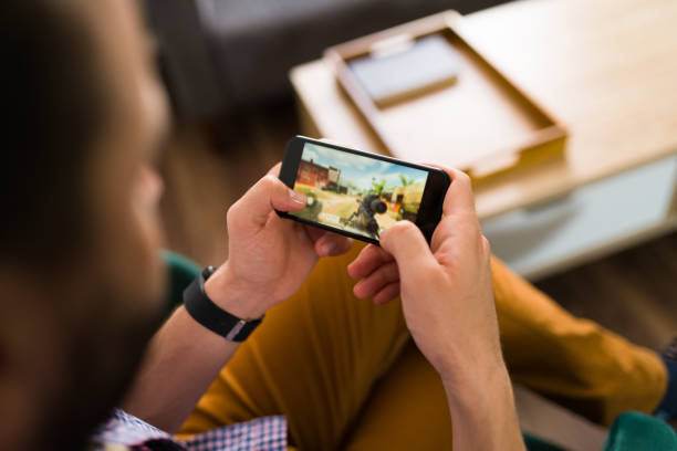 istock Adult man enjoying an online game 1337713406