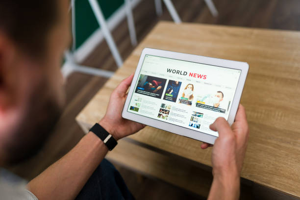 istock Person checking the news online 1337713432