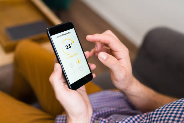 istock Man checking the weather app on the phone 1337713461