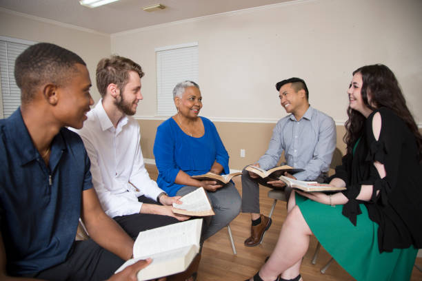 istock Bible Study.   Multi Ethnic Group.Multi Ethnic Group of friends meet for a Bible Study.  Group includes teenager, young adults, mid-adults and senior adult. 1337719625