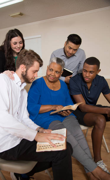 istock Bible Study.   Multi Ethnic Group.Multi Ethnic Group of friends meet for a Bible Study.  Group includes teenager, young adults, mid-adults and senior adult. 1337719668