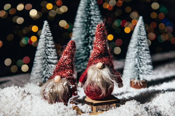 istock Christmas Gnomes in snowy forest, xmas postcard 1337721482