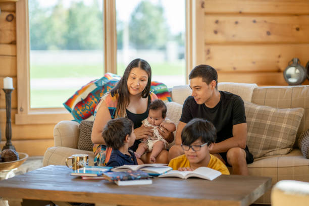 istock Young Indigenous family at home 1337721783
