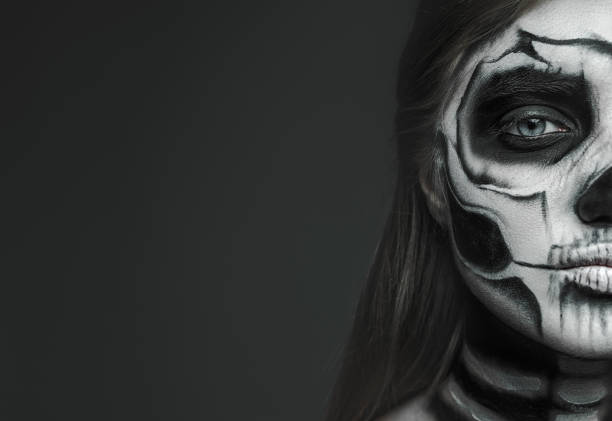istock Scary woman with skeleton makeup 1337722132