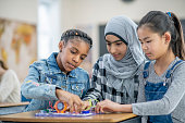 istock Diverse group of elementary school students in science class 1337723026