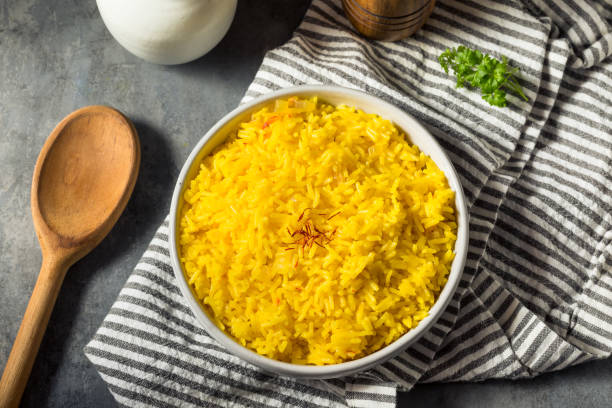 Homemade Healthy Saffron Rice Homemade Healthy Saffron Rice in a Bowl saffron stock pictures, royalty-free photos & images