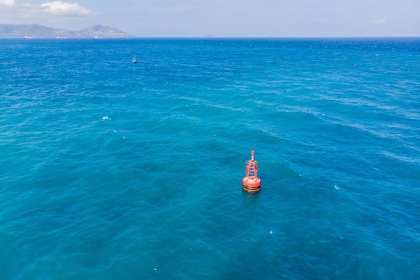 istock Floating red navigational buoy on blue sea, gulf. Drone 1337729799