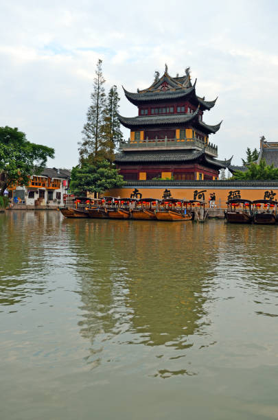 Old village by river in Shanghai with boat Old village by river in Shanghai with boat Zhujiajiao stock pictures, royalty-free photos & images